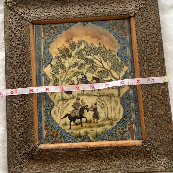 Hand painted on ivory? I am not an expert!! This is a very beautiful .